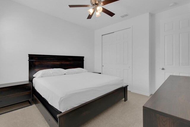 3017 Ambersweet Pl, Clermont, FL 34711 - bedroom featuring light carpet, a closet, ceiling fan, and baseboards