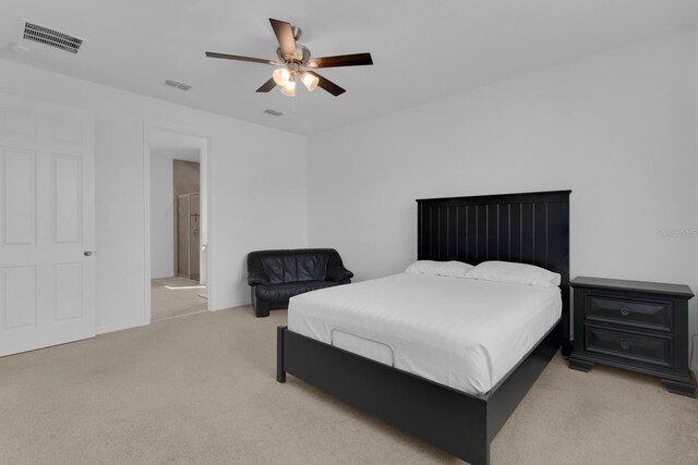 3017 Ambersweet Pl, Clermont, FL 34711 - bedroom with light colored carpet, a ceiling fan, and ensuite bath