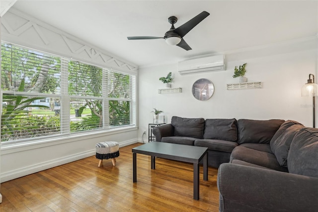 318 E Jersey St, Orlando, FL 32806 - living room featuring a wall mounted AC, baseboards, wood finished floors, and ceiling fan