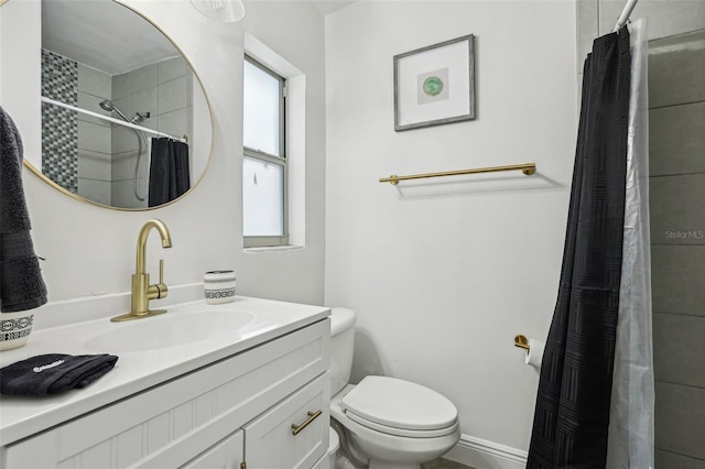 318 E Jersey St, Orlando, FL 32806 - bathroom featuring vanity, toilet, and a tile shower