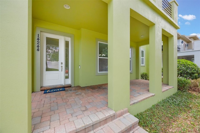 14244 Walcott Ave, Orlando, FL 32827 - doorway to property with stucco siding