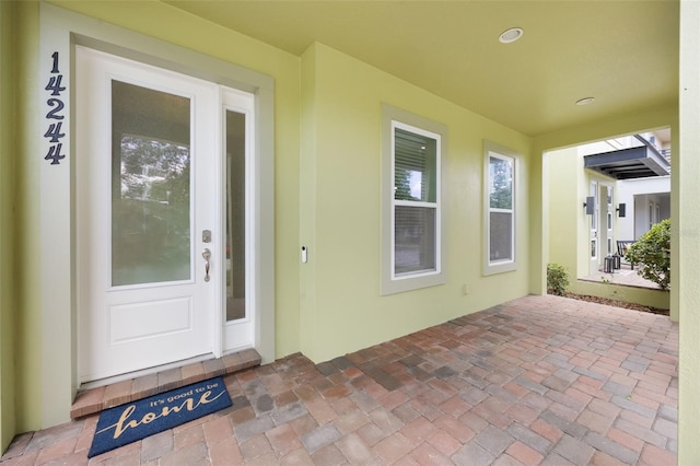 14244 Walcott Ave, Orlando, FL 32827 - property entrance featuring stucco siding and a patio area