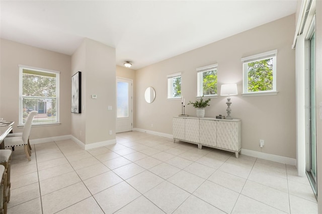 14244 Walcott Ave, Orlando, FL 32827 - entrance foyer featuring healthy amount of natural light and light tile patterned floors