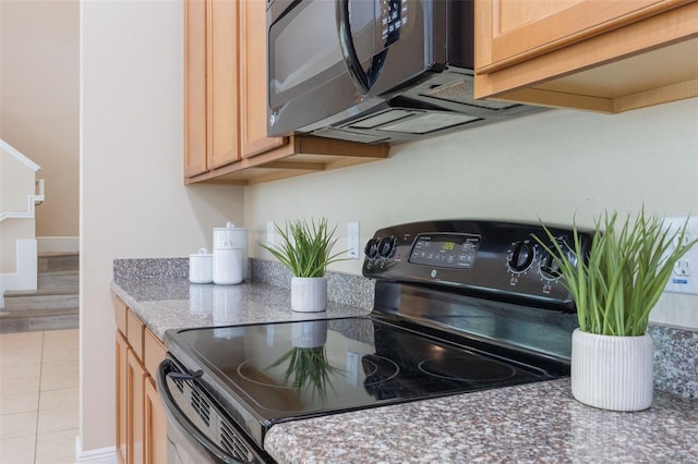 14244 Walcott Ave, Orlando, FL 32827 - kitchen view of black appliances, light brown cabinetry, and stone countertops