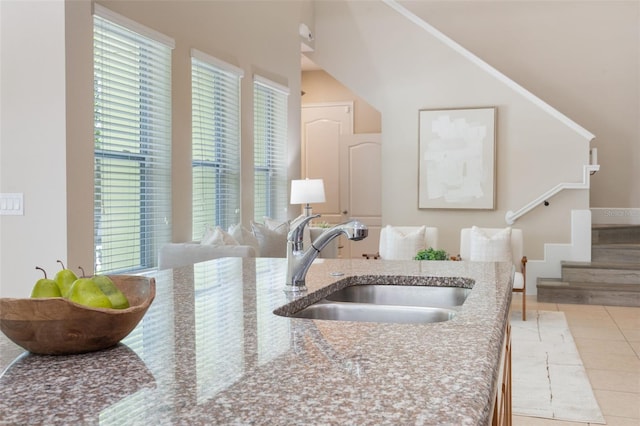 14244 Walcott Ave, Orlando, FL 32827 - kitchen with tile patterned floors and light stone counters
