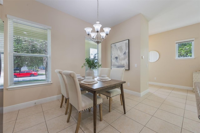 14244 Walcott Ave, Orlando, FL 32827 - dining room featuring a chandelier and light tile patterned floors