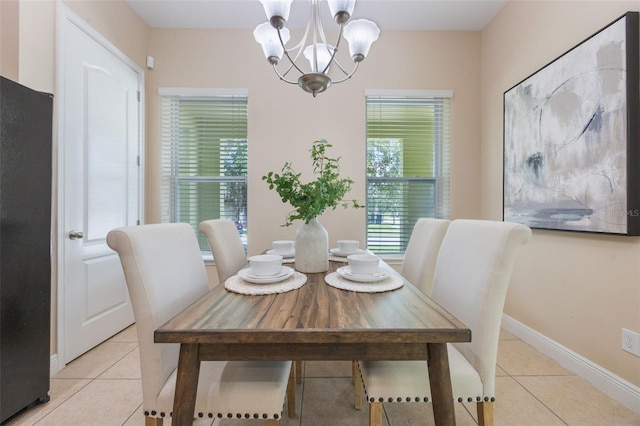 14244 Walcott Ave, Orlando, FL 32827 - dining space featuring light tile patterned flooring and a chandelier