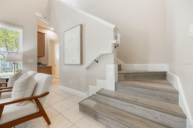 14244 Walcott Ave, Orlando, FL 32827 - staircase with tile patterned floors and baseboards