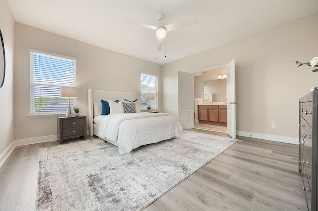 14244 Walcott Ave, Orlando, FL 32827 - bedroom featuring light wood finished floors, connected bathroom, and ceiling fan