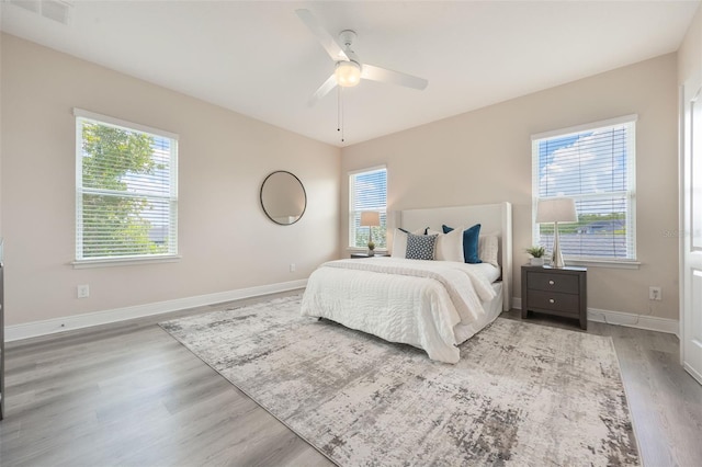 14244 Walcott Ave, Orlando, FL 32827 - bedroom with wood finished floors and a ceiling fan