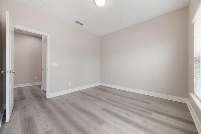 14244 Walcott Ave, Orlando, FL 32827 - empty room with light wood finished floors and plenty of natural light