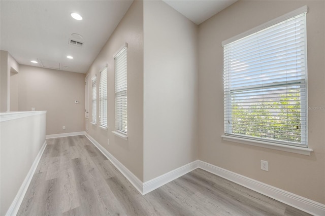 14244 Walcott Ave, Orlando, FL 32827 - hallway featuring attic access, light wood finished floors, and recessed lighting