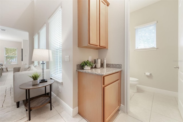 14244 Walcott Ave, Orlando, FL 32827 - bar area with light tile patterned floors