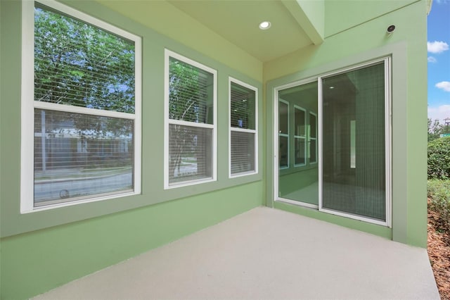 14244 Walcott Ave, Orlando, FL 32827 - unfurnished sunroom with plenty of natural light