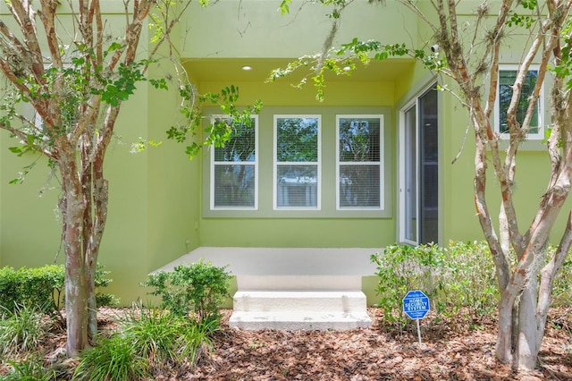 14244 Walcott Ave, Orlando, FL 32827 - doorway to property featuring stucco siding