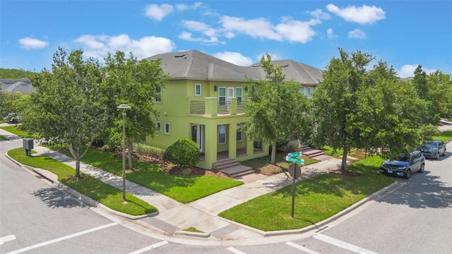 14244 Walcott Ave, Orlando, FL 32827 - view of front of property with a front lawn and stucco siding