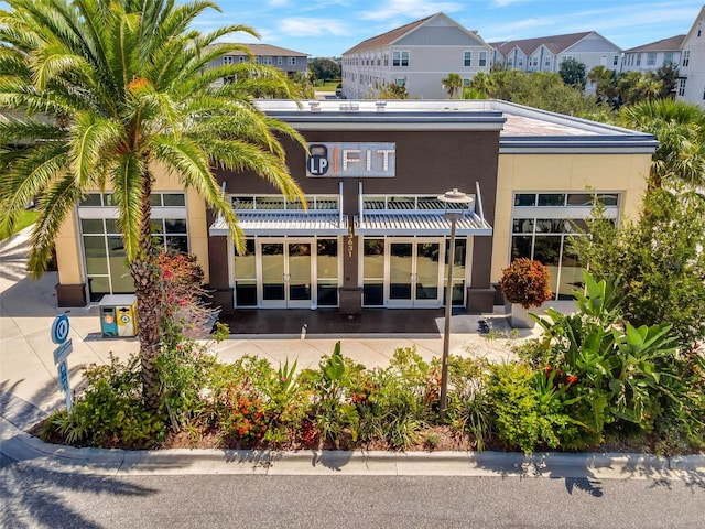 14244 Walcott Ave, Orlando, FL 32827 - rear view of house featuring a residential view and stucco siding
