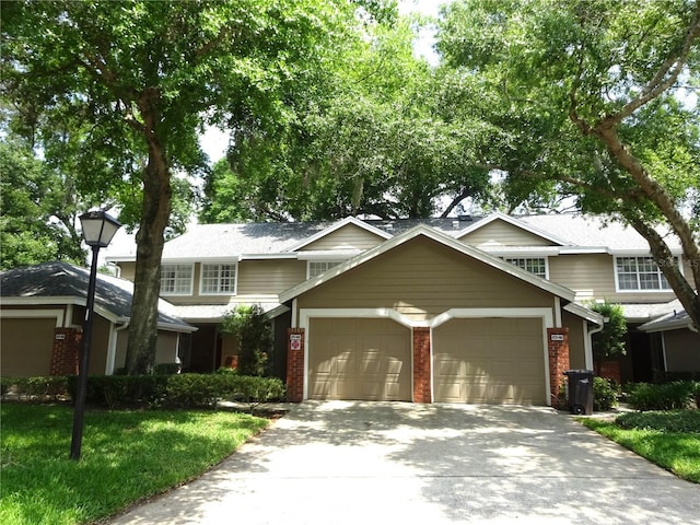 672 Post Oak Cir Unit 106, Altamonte Springs, FL 32701 - traditional-style home with an attached garage, concrete driveway, and brick siding