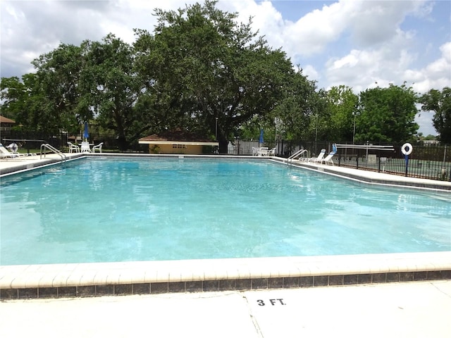 672 Post Oak Cir Unit 106, Altamonte Springs, FL 32701 - community pool with view of scattered trees