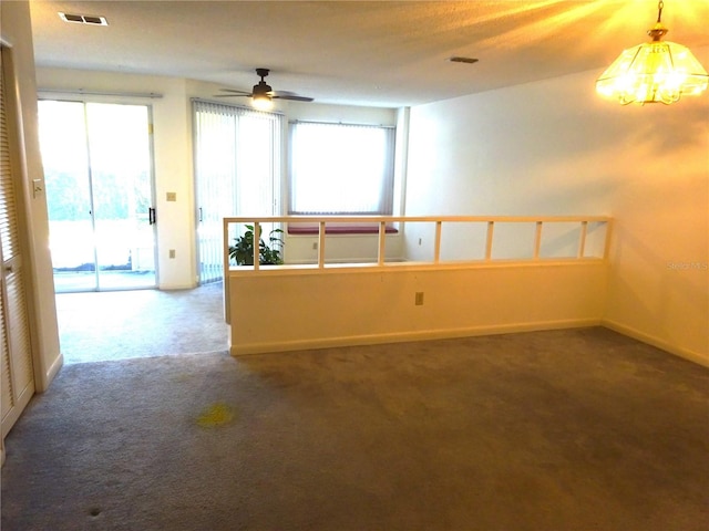 672 Post Oak Cir Unit 106, Altamonte Springs, FL 32701 - empty room featuring carpet flooring, a ceiling fan, a chandelier, and baseboards