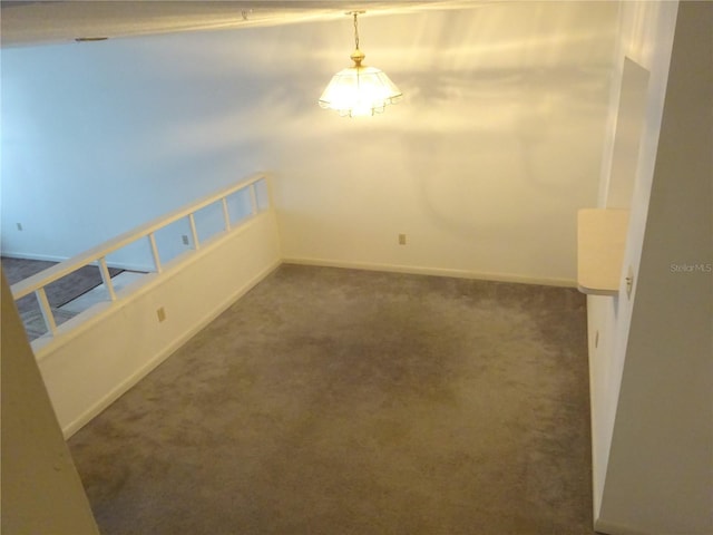 672 Post Oak Cir Unit 106, Altamonte Springs, FL 32701 - empty room featuring dark carpet and baseboards