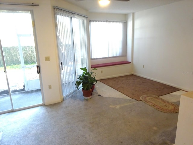 672 Post Oak Cir Unit 106, Altamonte Springs, FL 32701 - entryway with carpet floors, plenty of natural light, and baseboards