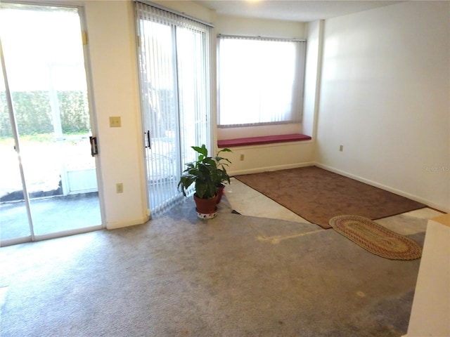 672 Post Oak Cir Unit 106, Altamonte Springs, FL 32701 - doorway to outside with carpet floors and baseboards