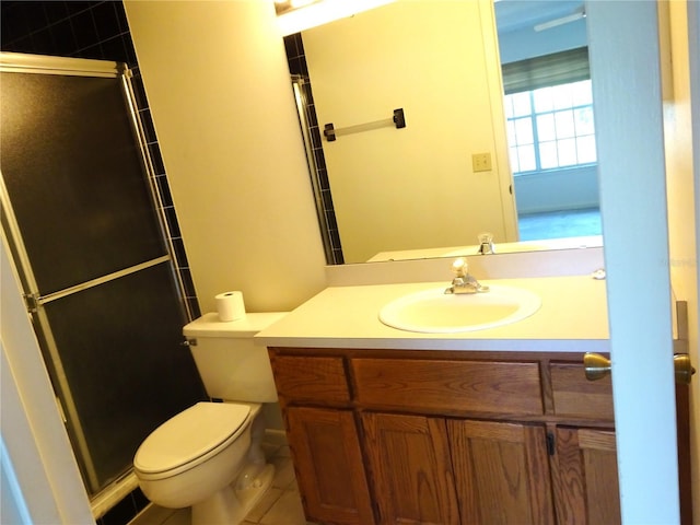 672 Post Oak Cir Unit 106, Altamonte Springs, FL 32701 - full bathroom with a shower stall, toilet, vanity, and tile patterned flooring