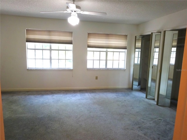 672 Post Oak Cir Unit 106, Altamonte Springs, FL 32701 - carpeted empty room with a textured ceiling, a ceiling fan, and baseboards