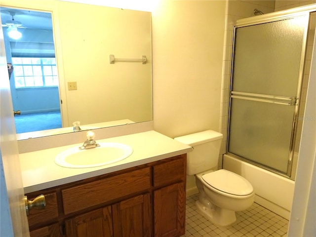 672 Post Oak Cir Unit 106, Altamonte Springs, FL 32701 - full bathroom featuring toilet, vanity, tile patterned floors, and combined bath / shower with glass door