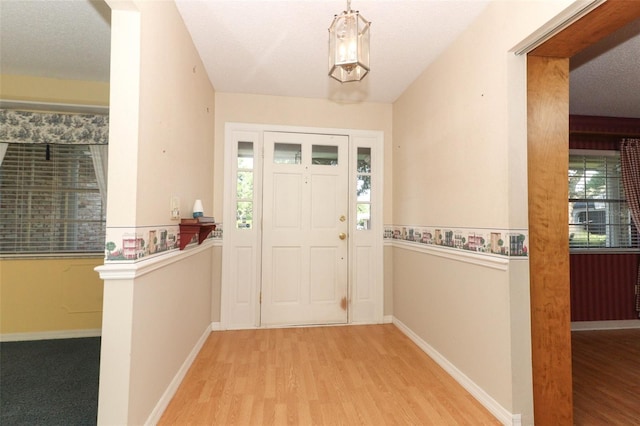4141 Fallwood Cir, Orlando, FL 32812 - entrance foyer with wood finished floors and baseboards