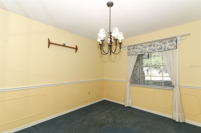 4141 Fallwood Cir, Orlando, FL 32812 - empty room with a chandelier, dark carpet, a textured ceiling, and baseboards