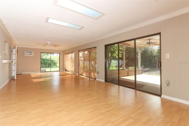 4141 Fallwood Cir, Orlando, FL 32812 - unfurnished room featuring ornamental molding, wood finished floors, ceiling fan, baseboards, and a skylight