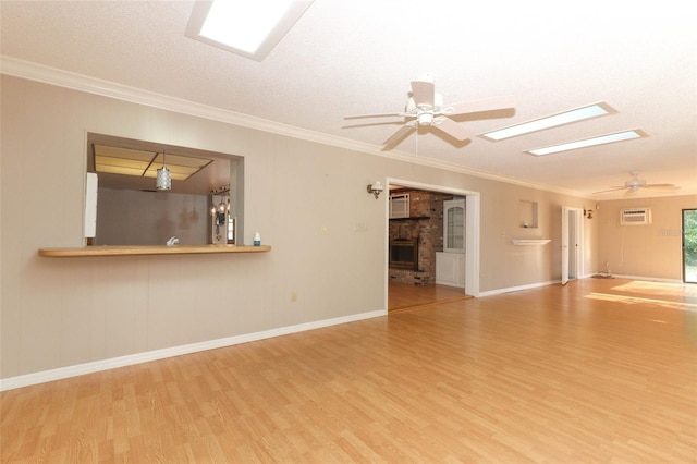 4141 Fallwood Cir, Orlando, FL 32812 - empty room with ceiling fan, wood finished floors, a wall unit AC, ornamental molding, and a brick fireplace