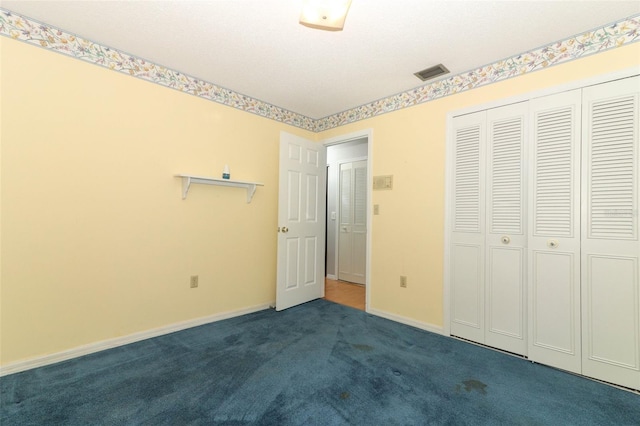 4141 Fallwood Cir, Orlando, FL 32812 - unfurnished bedroom featuring dark colored carpet, a closet, and baseboards
