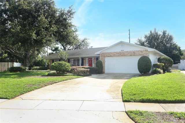 4141 Fallwood Cir, Orlando, FL 32812 - ranch-style house featuring an attached garage, driveway, and brick siding