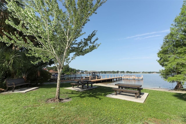 4141 Fallwood Cir, Orlando, FL 32812 - dock area featuring a yard and a water view