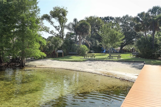 4141 Fallwood Cir, Orlando, FL 32812 - dock featuring a yard and a water view