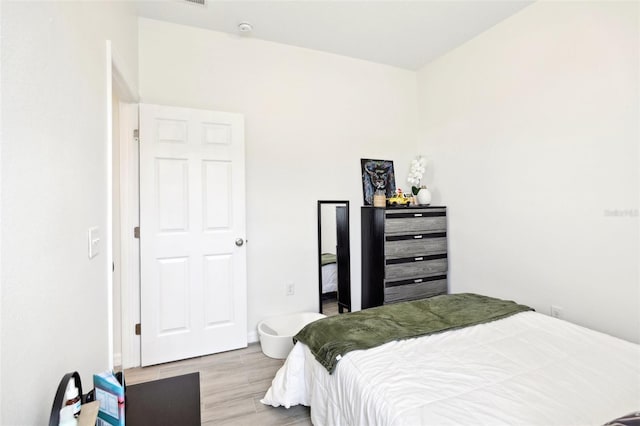 bedroom featuring wood finished floors