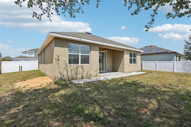 back of house featuring stucco siding, a patio area, and ceiling fan