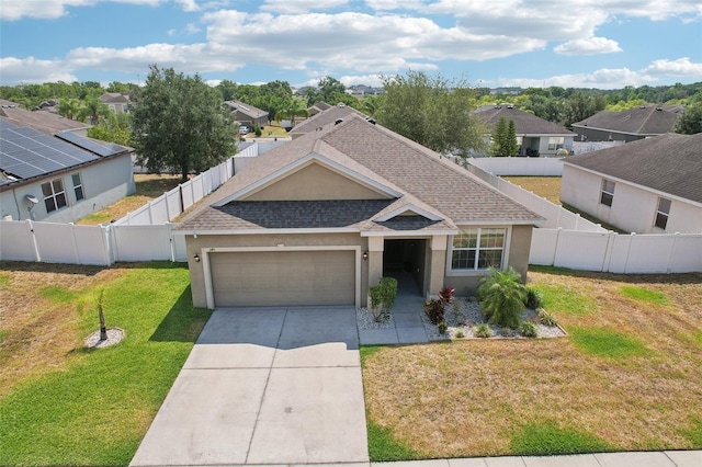 view of front of property featuring an attached garage, stucco siding, a residential view, and concrete driveway