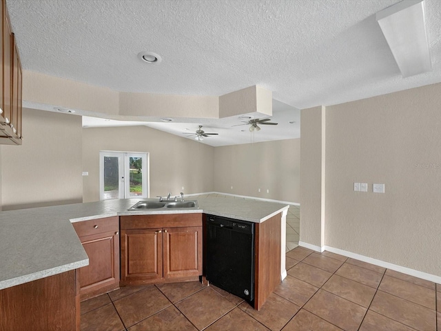 kitchen featuring black dishwasher, a sink, brown cabinetry, light tile patterned floors, and light countertops
