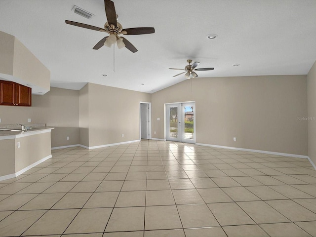 unfurnished living room featuring vaulted ceiling, a ceiling fan, light tile patterned flooring, baseboards, and recessed lighting