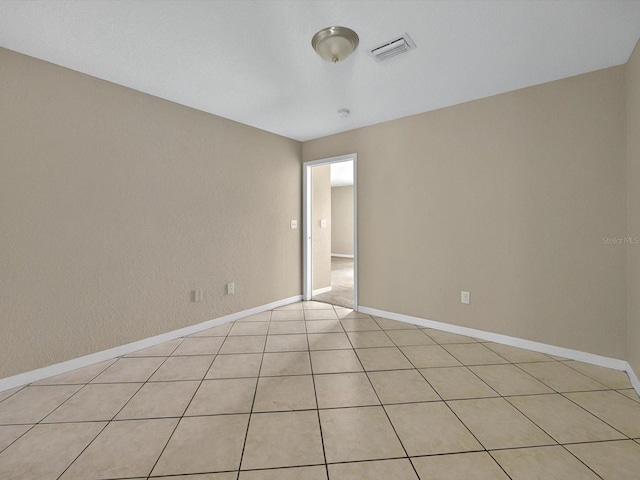 unfurnished room featuring baseboards