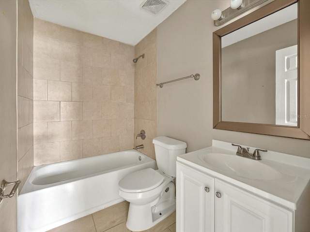 bathroom featuring toilet, washtub / shower combination, tile patterned flooring, and vanity