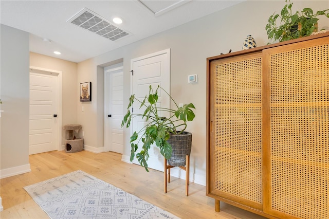 interior space with visible vents, wood finished floors, baseboards, and recessed lighting