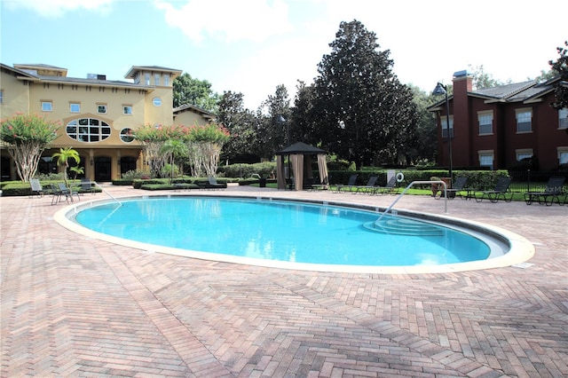 pool with a patio area