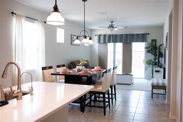 32618 Rapids Loop, Wesley Chapel, FL 33545 - dining space with a ceiling fan and light tile patterned floors