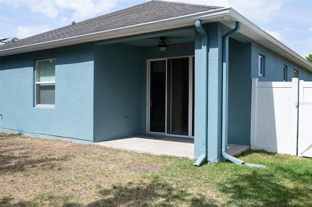 32618 Rapids Loop, Wesley Chapel, FL 33545 - back of property with a ceiling fan, stucco siding, a patio, and roof with shingles