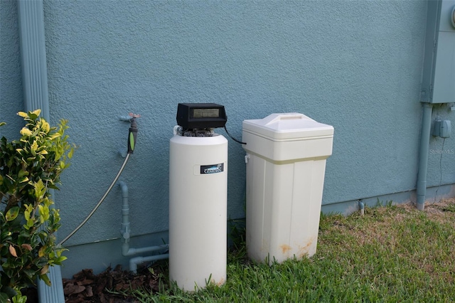 32618 Rapids Loop, Wesley Chapel, FL 33545 - exterior view of a water softener and stucco siding